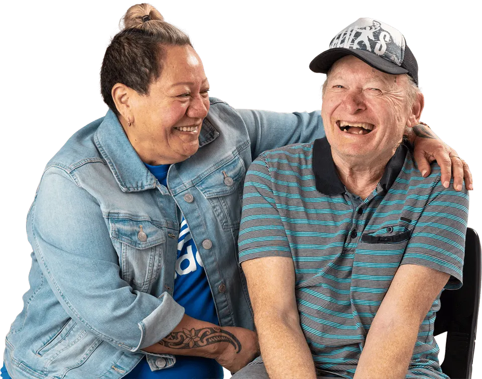 A together² support worker and an older man laughing together