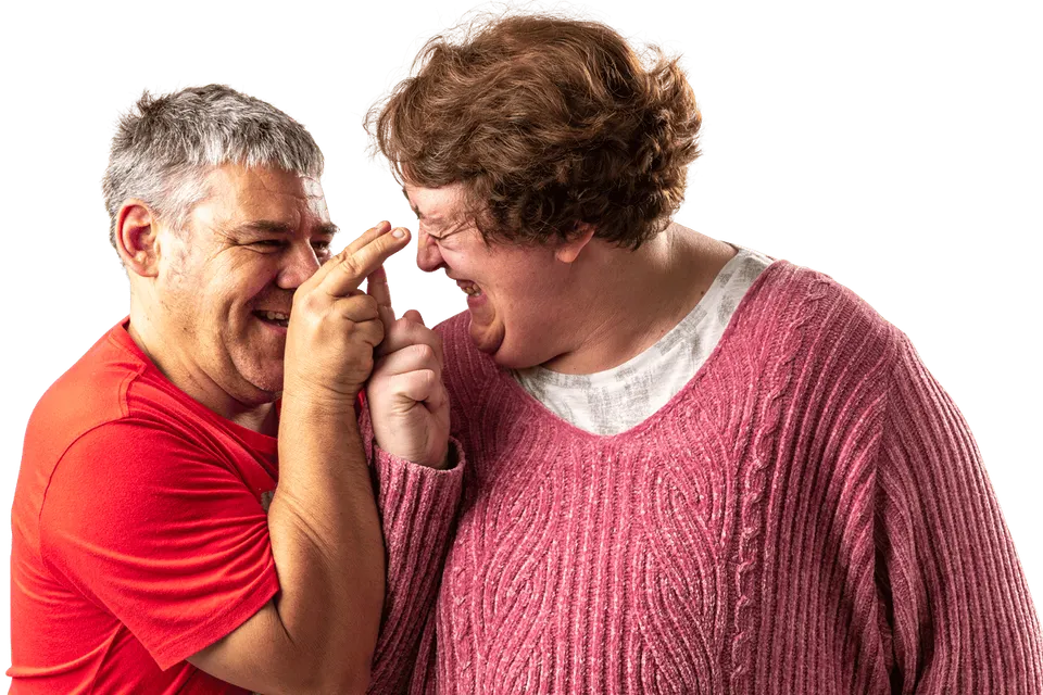 Two together² participants laughing together, heads close, mid-joke